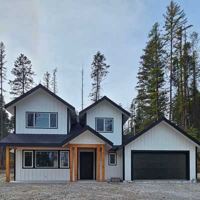 View of front facade with a garage | Image 1