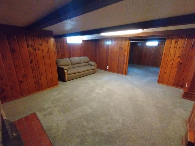 Cozy family room with knotty pine | Image 19
