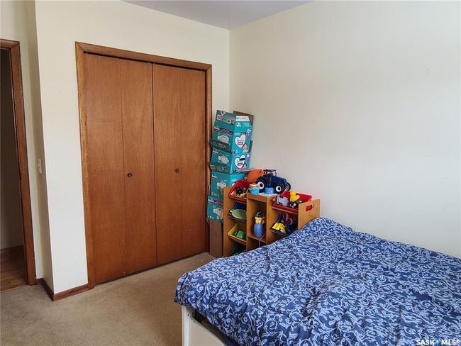Bedroom with light carpet and a closet | Image 21