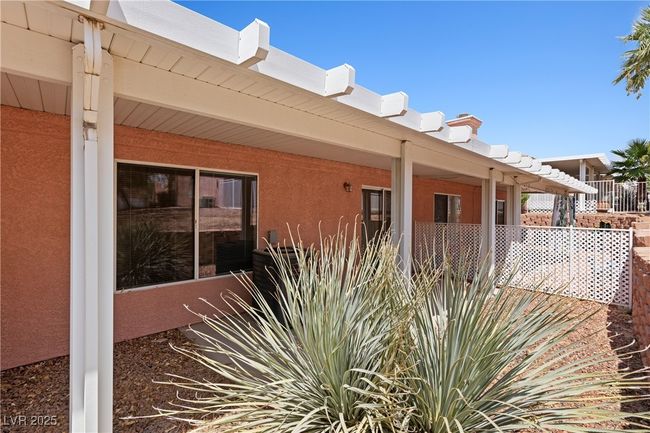 View of home's exterior featuring stucco siding and covered porch | Image 25