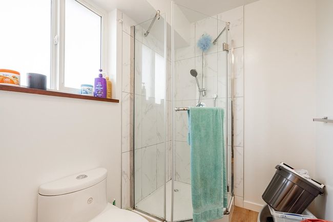 Bathroom with a stall shower and toilet | Image 20
