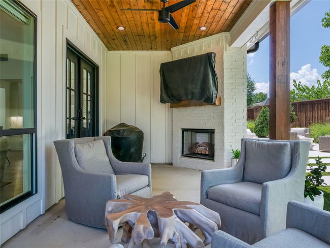 View of patio / terrace with an outdoor brick fireplace and a ceiling fan | Image 29