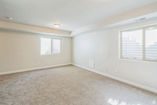 Spare room with carpet floors, healthy amount of natural light, and a smoke detector | Image 28