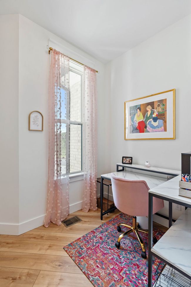 Main floor by the powder room there is a flex space that is set up as an office. | Image 38