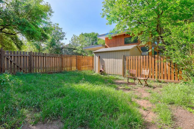 View of yard with a fenced backyard | Image 26