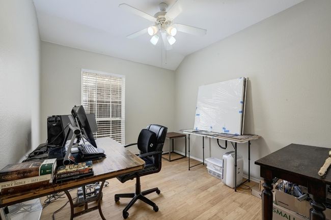 3rd BR or Office area with light wood-style floors, a ceiling fan, vaulted ceiling, and baseboards | Image 17