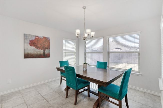 Tiled dining area featuring a chandelier | Image 12