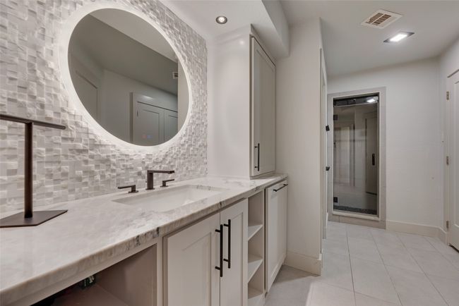 Basement bathroom with walk-in shower and direct access to pool area. | Image 30