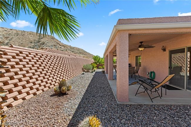 View of patio / terrace featuring ceiling fan and a mountain view | Image 44
