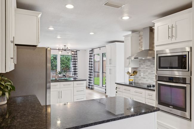 Kitchen layout offers multiple work spaces and is open so you can have more cooks in the kitchen! | Image 7