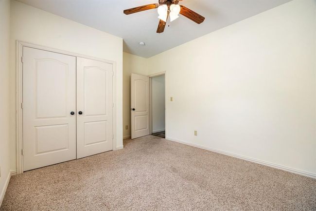 Secondary bedroom with new carpet and upgraded fixtures. | Image 18