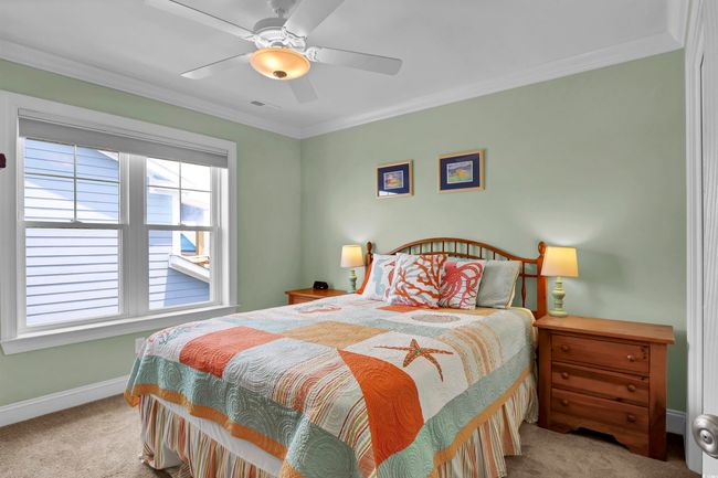 Carpeted bedroom featuring crown molding and a ceiling fan | Image 21