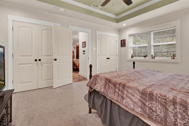 This bedroom leads directly to the main part of the home. It has a roomy closet and the main bathroom for the house is just outside the door of this room. | Image 25