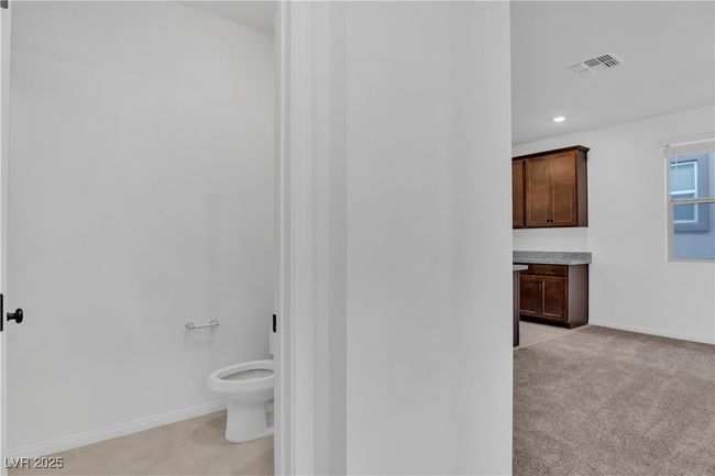 Bathroom with baseboards, visible vents, toilet, and recessed lighting | Image 10
