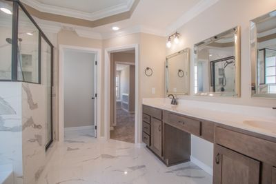 Amazing Primary Bathroom Features Polished Tile, Recessed Lighting, a Gorgeous Double Tray Ceiling with Color Changing Lighting, Crown Molding, Tile Shower, Soaker Tub, Huge Double Vanity & a Toilet Room! | Image 1