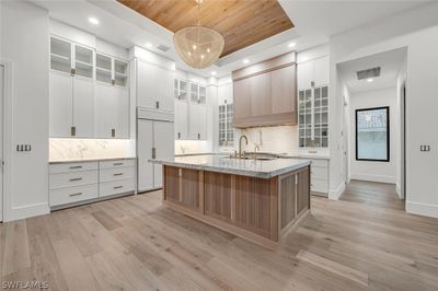 Front Elevation with captivating cedar garage doors | Image 1