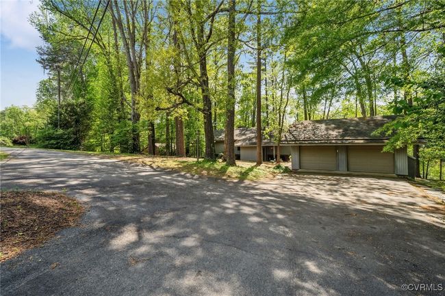 View of front of house with aphalt driveway and a garage | Image 9