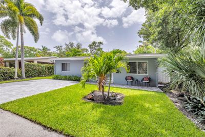 Attractive front yard on a quiet street with paver front patio and driveway. | Image 2