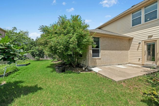 View of green lawn with a patio | Image 34