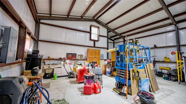 Garage with a workshop area | Image 6