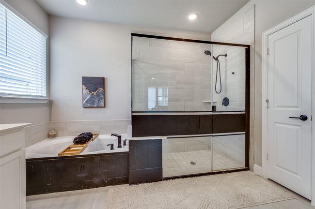 Full bath with vanity, a stall shower, and a garden tub | Image 30