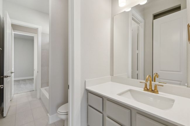 Bathroom with vanity and tile patterned flooring | Image 25