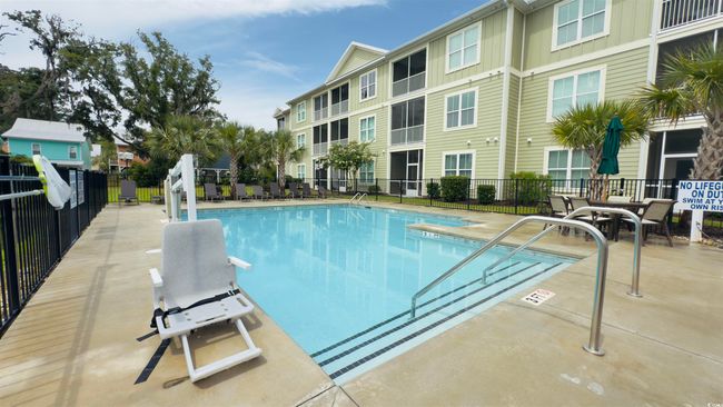 Community pool featuring a patio area | Image 37