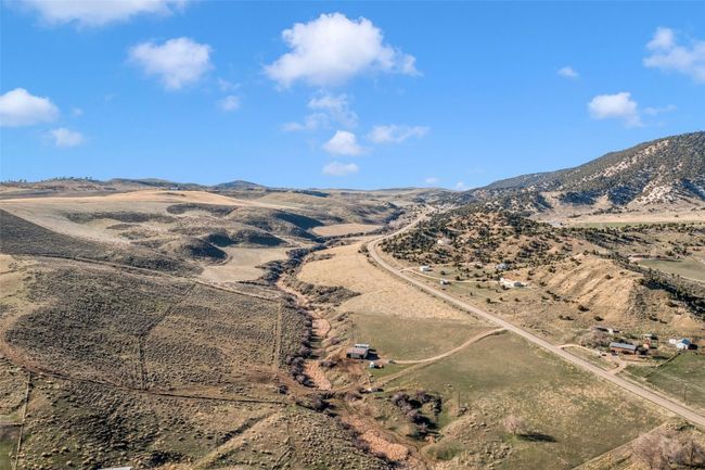 View of mountain backdrop with rural landscape | Image 11