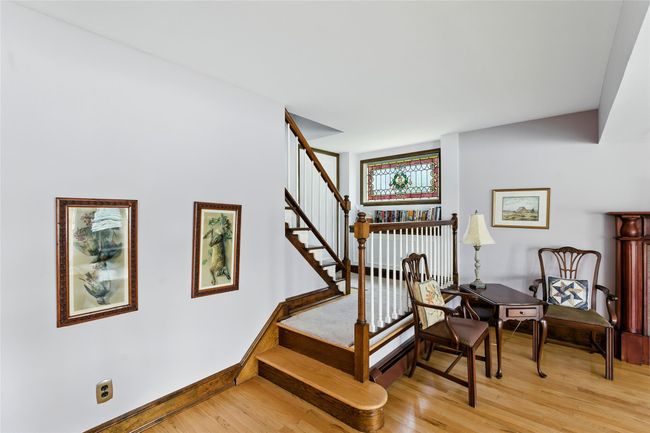 Stairway featuring wood finished floors | Image 28