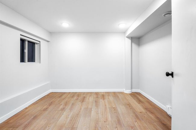 Empty room featuring baseboards and wood finished floors | Image 10