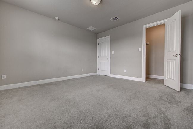 Unfurnished bedroom featuring carpet flooring and baseboards | Image 20