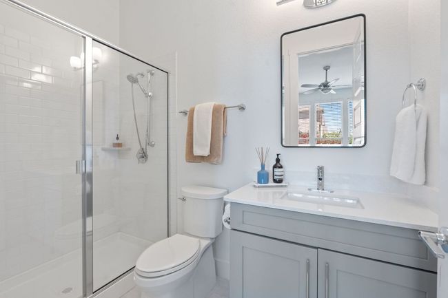 Full bathroom featuring ceiling fan, vanity, and a stall shower | Image 32