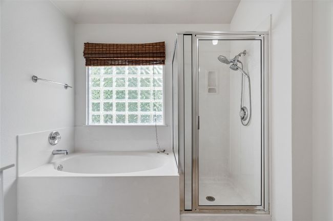 Primary Bath features Garden Tub and Walk-In Shower | Image 19