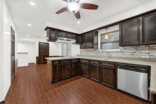 View through the kitchen into the formal dining. | Image 20