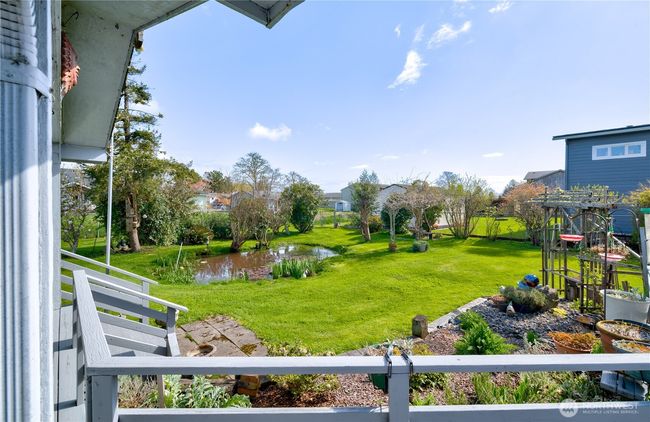 From the deck looking towards the fenced and landscaped back yard. | Image 38