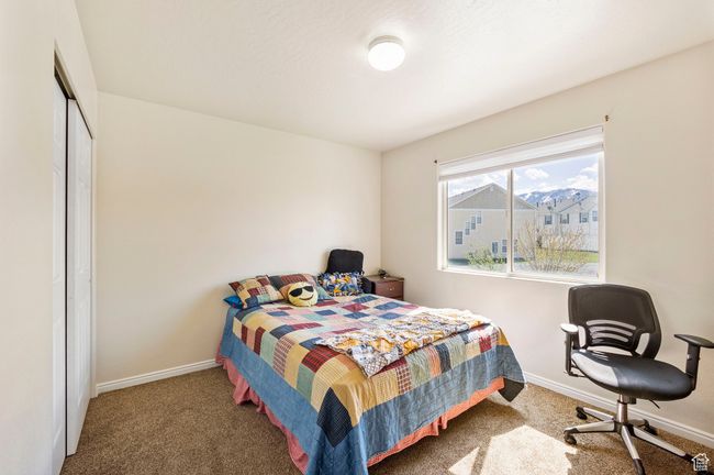 Bedroom featuring baseboards, carpet flooring, and a closet | Image 23