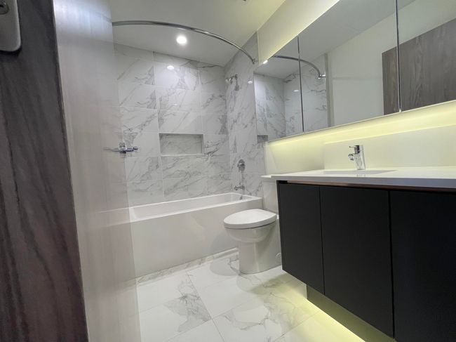 Bathroom with toilet, recessed lighting, vanity, shower combination, and marble finish floor | Image 19