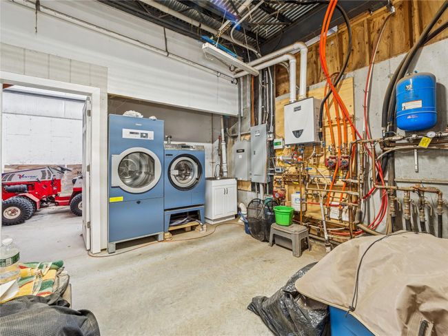 Tack room with professional Miele equestrian washer dryer | Image 22