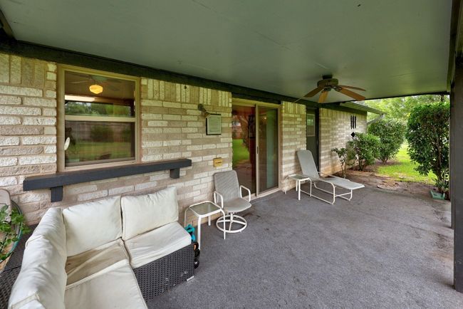 View of patio / terrace with ceiling fan and outdoor lounge area | Image 28
