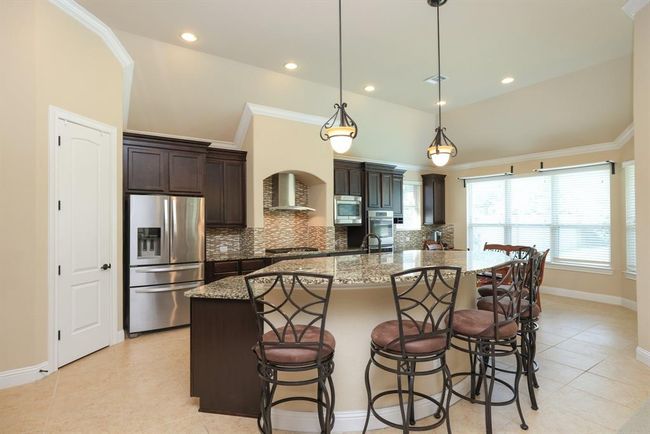 WOW, look at this large island with granite tops! | Image 15