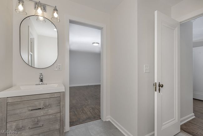 Bathroom featuring hardwood / wood-style flooring and vanity | Image 25