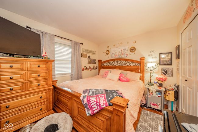 bedroom featuring a closet | Image 24