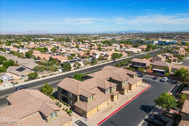 Aerial view of residential area featuring a mountain backdrop | Image 45
