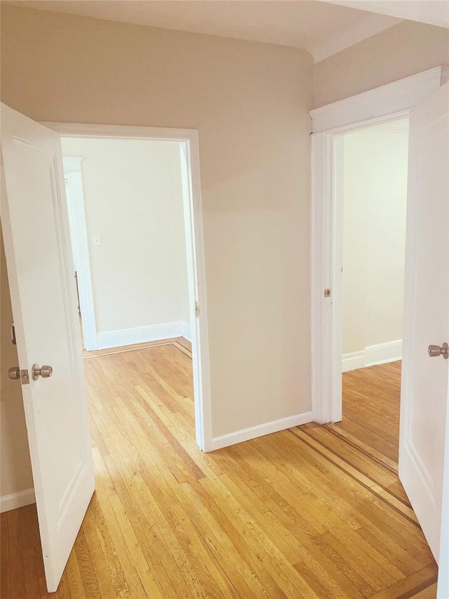 Hall with light wood-type flooring | Image 7