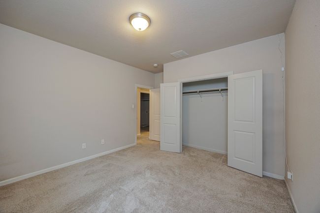 Unfurnished bedroom featuring light colored carpet and a closet | Image 30