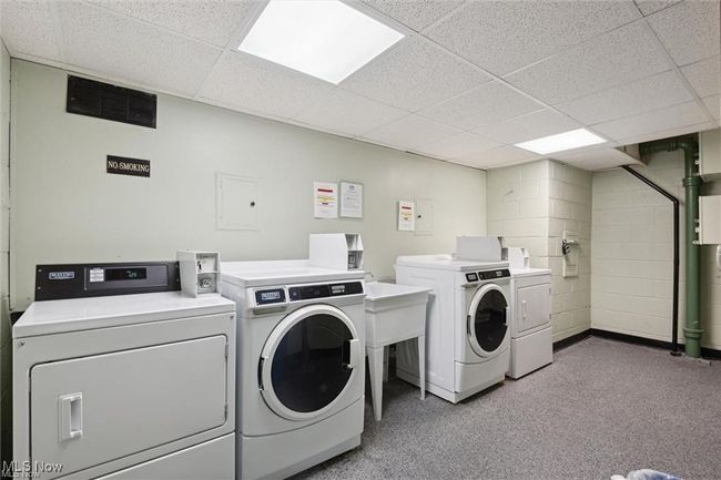 Common laundry area featuring carpet flooring and independent washer and dryer | Image 4