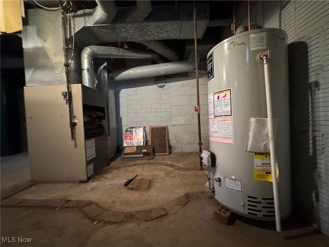 Utility room featuring gas water heater | Image 25
