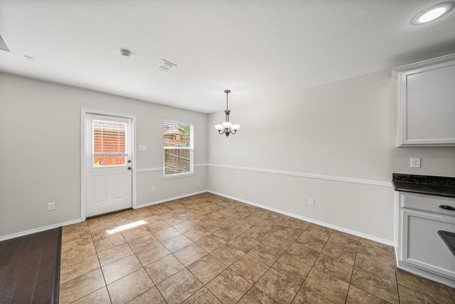 Unfurnished dining area with a chandelier and baseboards | Image 18