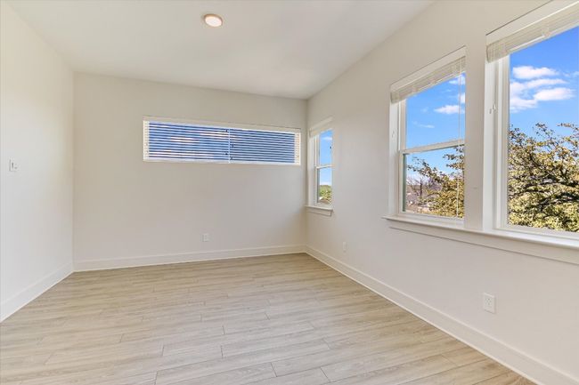 Unfurnished room featuring light wood-type flooring and baseboards | Image 17