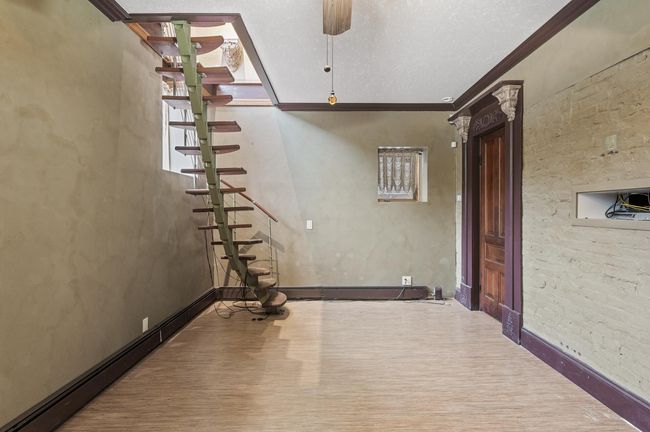 The room is wired for a television mount. A large walk-in cedar closet is located through the antique door. | Image 23